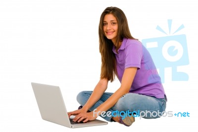 Smiling Teenage Girl Using Laptop Stock Photo