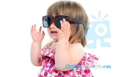 Smiling Toddler Wearing Sunglasses Stock Photo