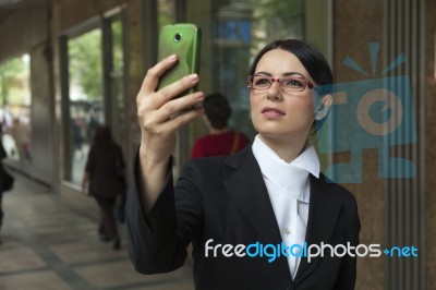 Smiling Woman Capturing A Self Shot Stock Photo