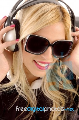 Smiling Woman Enjoying Music Stock Photo