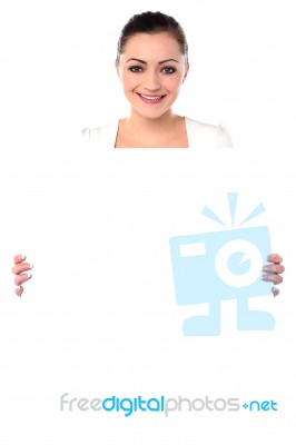 Smiling Woman Holding Blank White Ad Board Stock Photo