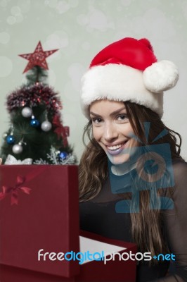 Smiling Woman Holding Gift Box Stock Photo