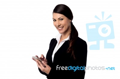 Smiling Woman Holding Mobile Phone Stock Photo