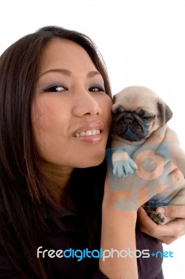 Smiling Woman Holding Puppy Stock Photo