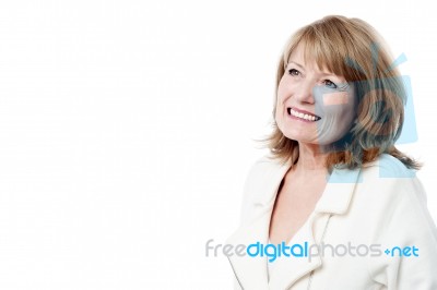 Smiling Woman Looking Up Stock Photo