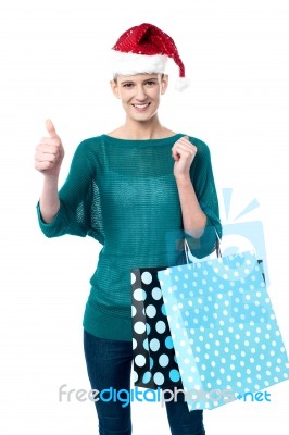 Smiling Woman Shopping For Christmas Stock Photo