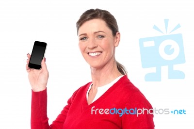 Smiling Woman Showing A Smart Phone Stock Photo