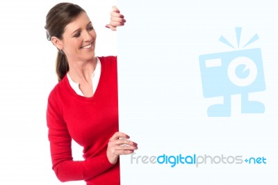 Smiling Woman Showing Blank Signboard Stock Photo