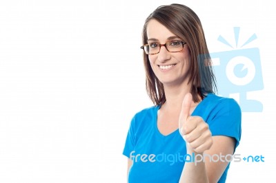 Smiling Woman Showing Thumbs Up Gesture Stock Photo