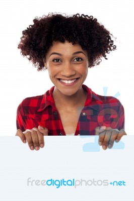 Smiling Woman Standing Behind Blank Whiteboard Stock Photo