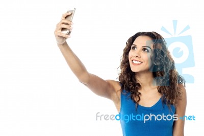 Smiling Woman Taking Photo Of Herself Stock Photo