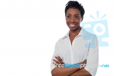 Smiling Woman With Arms Crossed Stock Photo