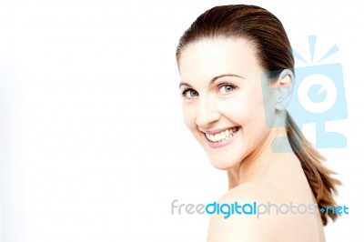 Smiling Woman With Bare Shoulders Stock Photo