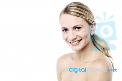 Smiling Woman With Bare Shoulders Stock Photo