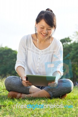 Smiling Woman With Digital Tablet Stock Photo