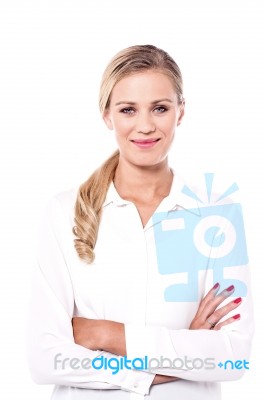 Smiling Woman With Folded Arms Stock Photo