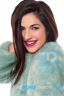 Smiling Woman With Fur Coat Stock Photo