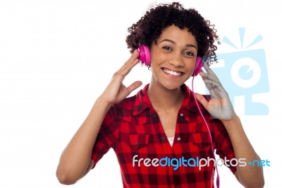 Smiling Woman With Pink Headphones On Stock Photo