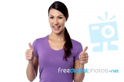 Smiling Woman With Thumbs Up Gesture Stock Photo