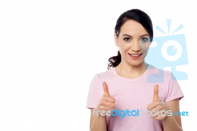 Smiling Woman With Thumbs Up Gesture Stock Photo