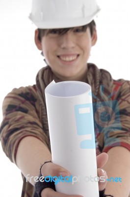 Smiling Young Architect Showing Paper Roll Stock Photo