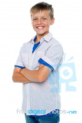 Smiling Young Boy With Crossed Arms Stock Photo