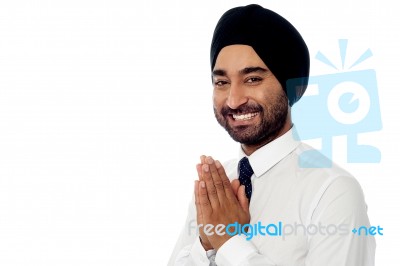 Smiling Young Businessman Greeting Stock Photo