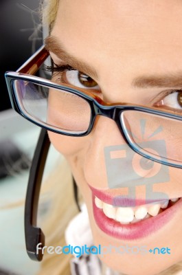 Smiling Young call centre lady Stock Photo