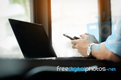 Smiling Young Casual Business Man With Mobile Phone In The Hand Stock Photo