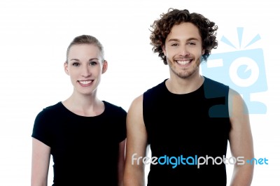 Smiling Young Couple In Casuals Stock Photo