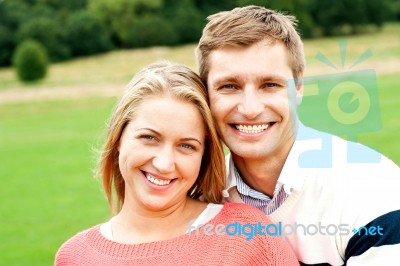 Smiling Young Couple In Outdoor Stock Photo