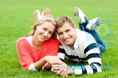 Smiling Young Couple In Outdoor Stock Photo