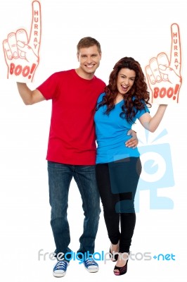 Smiling Young Couple Wearing Gloves Stock Photo