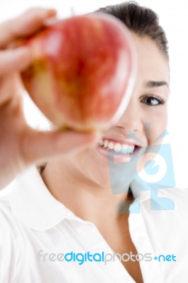 Smiling Young Female Showing Apple Stock Photo