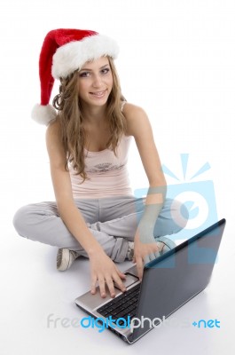 Smiling young girl using laptop Stock Photo