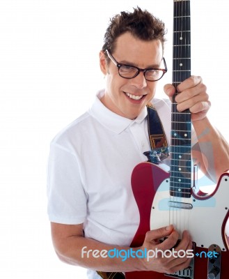 Smiling Young Guitarist Stock Photo