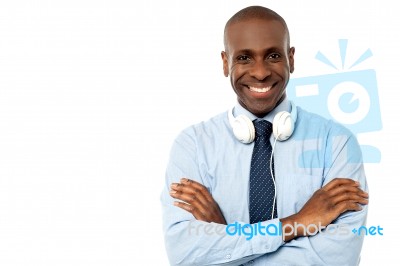 Smiling Young Guy Hanging Headphones In His Neck Stock Photo