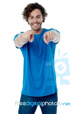 Smiling Young Guy Pointing At You Stock Photo