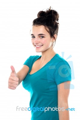 Smiling Young Lady Showing Thumb Up Stock Photo