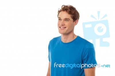 Smiling Young Man Looking Away Stock Photo