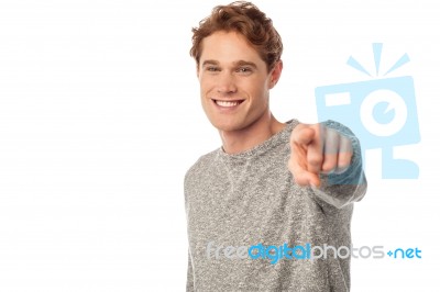 Smiling Young Man Pointing You Out Stock Photo