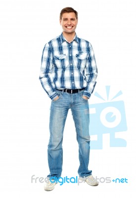 Smiling Young Man Standing On White Stock Photo