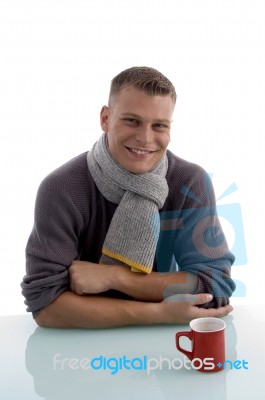 Smiling Young Man With Coffee Mug Stock Photo