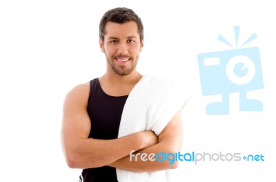 Smiling Young Man With Crossed Arms Stock Photo