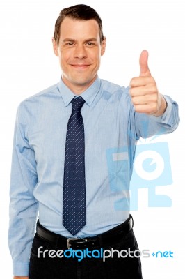 Smiling Young Man With Thumbs Up Gesture Stock Photo