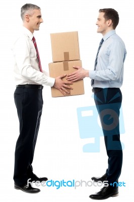 Smiling Young Men Receive Cartons Boxes Stock Photo