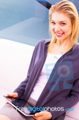 Smiling Young Woman Holding Digital Tablet Stock Photo