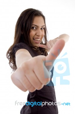 Smiling Young Woman Showing Thumb Up Stock Photo