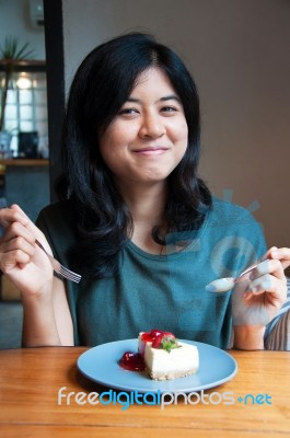 Smiling Young Woman With A Cake Stock Photo