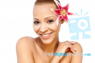 Smiling Young Woman With A Lily Flower Stock Photo